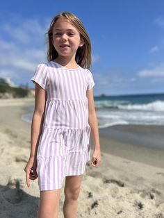 Vignette Girls best selling Iona Dress is back! This dress offers the perfect cap sleeve and tiered skirt, paired with comfy fabric. Sizing: Vignette fits true to size. You can also size up by one full size if you want extra room to grow. Feel free to contact our shop for a measurement at 214-517-0882. Casual Short Sleeve Twirl Dress With Ruffle Hem, Lavender Cream, Extra Room, Purple And White, Tiered Skirt, Cap Sleeve, Stripes Pattern, Cap Sleeves, Unique Pieces