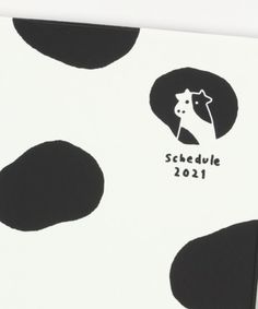 a black and white cow with the word schedule 2012 on it's back side