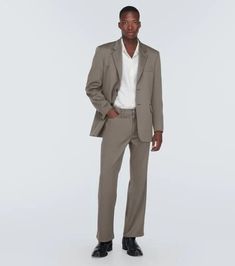 Soft Italian wool pants with a striking flared silhouette. Crafted using THE heritage brand's signature impeccable tailoring in an earthy Mole Grey hue. Wide-legs add laidback cool to your look while subtle pockets lend versatility. At 100% wool, they drape beautifully yet remain breathable for all day comfort. Designed to elevate your style, these sculpturally sharp yet casual pants let your creative spirit shine through. Simple style elevated - your new wardrobe essential. Wool Suits With Straight Pants For Work, Business Casual Straight Leg Fall Suits, Wool Dress Pants For Business Casual, Spring Season, Fall Business Casual Straight Leg Suits, Wool Dress Pants For Business Casual In Spring, Wool Suits With Pressed Crease And Straight Pants, Tailored Wool Wide-leg Dress Pants, Fall Business Suit With Straight Leg, Tailored Wool Dress Pants For Spring