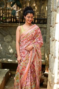 Pretty as a picture! Presenting a distressed Kalamkari Digital Printed Silk Linen Saree in a soothing pastel tone. The antique Zari border gives the saree a traditional charm. A lovely saree that beautifully blends trend and tradition! The saree comes with an unstitched running blouse in peach with borders. The saree is shipped with falls and pico done. Long handmade tassles lend charm! Note: Product color may slightly vary due to variance in device settings. Kalamkari Digital Print, House Of Blouse, Kalamkari Saree, Linen Saree, Silk Linen, Brocade Fabric, Linen Blouse, Banarasi Sarees, Blouse Online