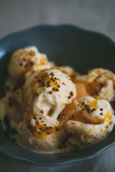 a blue bowl filled with ice cream and toppings