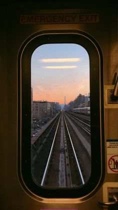 looking out the window of a commuter train