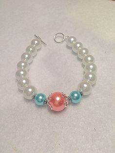 A personal favorite from my Etsy shop https://www.etsy.com/listing/580818639/bridesmaid-beaded-bracelet-aqua-orange White Pearl Jewelry For Bridesmaids, White Pearl Bridesmaid Jewelry, Pink Pearl Bracelet For Wedding, Pearl Bracelets For Bridesmaid Gift, 8mm Pearl Bead Bracelets For Weddings, White Beaded Jewelry For Bridesmaid Gift, Adjustable Pearl White Bracelet For Bridesmaids, Wedding Pearl Bracelet With 8mm Beads, White Beaded Bracelets For Bridesmaid Gift