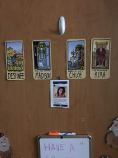 a bulletin board with pictures on it and magnets attached to the back of it