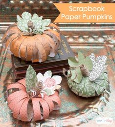 scrapbook paper pumpkins are stacked on top of each other