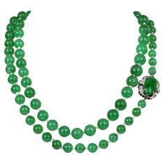 A strand of Natural No Treatments  Genuine Green Jade Beads adds a touch of life to any outfit. This piece is versatile in how the wearer prefers; it can be worn in a single or double style. 80 Finely & evenly vivid green matched 5 mm to 8 mm beads complete this strand. Secured with a 14K White Gold Gallery insert clasp, with an Oval Jade & 6 Round Single cut diamonds, weighing collectively 0.10 carats, H-I color & SI clarity. Remains in Excellent Condition. Accompanied by a GIA report # 6223606 Jade Bead Necklace, High End Jewelry, Diamond Weave, Yellow Gold Wedding Band, Emerald Bead, Jewelry Appraisal, Jade Necklace, Jade Jewelry, Natural Jade