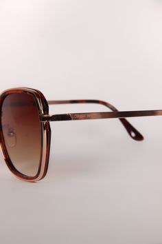 Introducing our Retro Tortoise Ombre sunglasses—a timeless embodiment of vintage allure and modern elegance. These iconic eyewear pieces feature classic retro frames with a distinguished tortoise pattern, marrying traditional charm with contemporary style. The retro frame design is a tribute to an era of glamour and sophistication. Meticulously crafted with intricate detailing, the tortoise frames offer a perfect fusion of classic aesthetics and fashion-forward sensibility, making them an essent Classic Tortoiseshell Sunglasses With Uv Protection, Brown Tinted Glass Aviator Sunglasses, Classic Brown Square Frame Sunglasses, Vintage Tortoiseshell Sunglasses, Classic Tortoiseshell Cat Eye Sunglasses, Formal Tortoiseshell Sunglasses With Uv Protection, Formal Tortoiseshell Sunglasses With Gradient Lenses, Brown Square Frame Aviator Sunglasses With Metal Frame, Brown Square Frame Metal Aviator Sunglasses