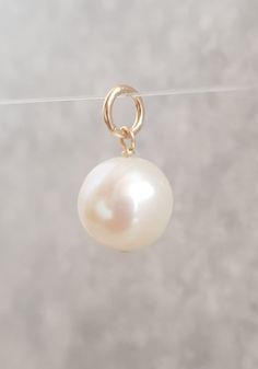 Beautiful  white freshwater pearl for you to put on your own necklace or bracelet.  Approximately 12mm near round pearl has a nice creamy white lustre, It has a 6mm ring bail with the inside diameter measuring approx 5mm. All the metal parts including the jump ring are gold filled. The overall length of the pearl charm / pendant, measuring from the top of the ring is approx. 2cm. The pearl in the photos is the actual pearl you will receive. I use pearls are genuine freshwater pearls therefore ea White Freshwater Pearl, Pearl Charms, Necklace Chain, White Pearl, Jump Rings, Pearl Pendant, Wedding Shop, Pearl White, Charm Pendant