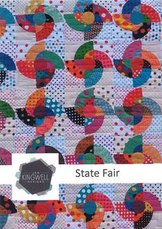 the cover of state fair quilt pattern, featuring colorful circles and dots on white fabric