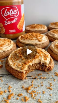 cookies with frosting and cinnamon sprinkles next to a jar of peanut butter