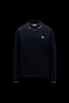 A timeless design that transcends seasons, this long sleeve polo shirt is crafted from cotton piqué. The classic style is embellished with a Moncler logo patch on the chest. Designer Blue Cotton Polo Shirt, Luxury Blue Collared Polo Shirt, Luxury Long Sleeve Polo Sweater, Luxury Navy Collared Top, Luxury Blue Long Sleeve Tops, Luxury Navy Polo Shirt, Luxury Blue Polo Collar Top, Classic Long Sleeve Cotton Polo Shirt, Luxury Tops With Polo Ribbed Collar