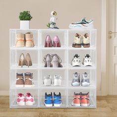 a clear plastic shoe rack filled with pairs of shoes