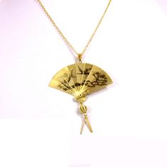 "1970s Large folding fan necklace 14kt gold plated with your choice of chain size 16\", 18\" or 20\"at no additional charge. The fan measures approximately 2\" wide by 2 1/4\" high with a scene of etched cranes taking flight and landing. In the Chinese culture fans were worn made of different materials to represent wealth and status. The  flying cranes in Japanese culture are symbols of good fortune and longevity. This particular style of cross has a brooch type pin on back to secure it if you w Retro Gold-tone Jewelry For Gift, Retro Gold-tone Jewelry Gift, Retro Gold Nickel-free Jewelry, Retro Nickel-free Gold Jewelry, Retro Gold Medallion Jewelry, Retro Gold Jewelry For Gifts, Retro Gold Engraved Jewelry, Retro Engraved Gold Jewelry, Retro Gold Brass Necklace