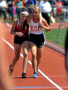 two women running on a race track