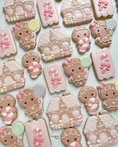 many decorated cookies are displayed on a table