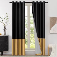 black and gold curtains in front of a window