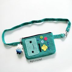 a small purse with an animal on the front and a keychain attached to it