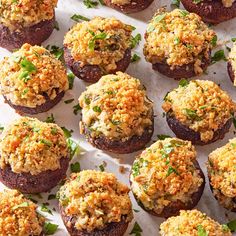 small stuffed mushrooms with cheese and herbs on top are ready to be served in the oven