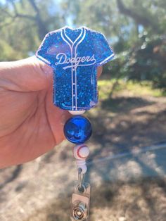 "LA Dodgers 2 \" Badge Reel available with beads. I can add your players number, just message me. Badge reels are attached with 3M dual lock velcro and are interchangeable. If you prefer a permanent glue please send me a note when you purchase. Comes with Alligator clip. Slide clip available upon request. Care instructions: Please avoid dropping, while items are durable, they are not indestructible. Please handle with care. Different colors available. Send me a message for customs. RETURNS/EXCHA Badge Reels Diy, Dodgers Girl, Pop Sockets, Small Business Packaging Ideas, Beads Charm, Pop Socket, Beadable Products, Baseball Gifts, Scroll Saw Patterns