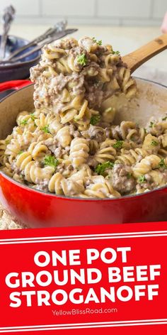 one pot ground beef stroganoni in a red pan with a wooden spoon