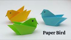 three origami birds sitting next to each other on a white background with the words paper bird