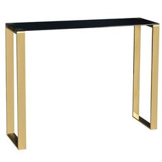 a black and gold console table with two legs on each side, in front of a white background