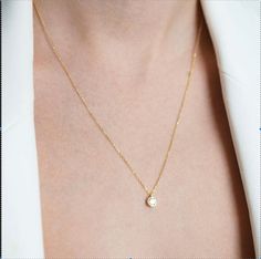 If you're in search of a piece of jewelry that beautifully combines elegance with simplicity, look no further than our Minimalist Gold Solitaire Necklace . This exquisite necklace is a symbol of refined style and grace. Product Details: Material: This necklace is made from high-quality 8K gold, ensuring its lasting beauty and durability. Design:The delicate Solitaire Necklace adds a touch of elegance to your neckline, while its minimalist design makes it suitable for various occasions, from casu Classic Clavicle Chain Charm Necklace For Formal Events, Classic Clavicle Chain Charm Necklace For Formal Occasions, Classic Clavicle Chain Charm Necklaces For Formal Events, Classic Charm Necklaces With Clavicle Chain For Formal Occasions, Elegant Everyday Solitaire Necklace With Round Pendant, Minimalist Solitaire Diamond Necklace, Minimalist Round Cut Solitaire Necklace, Minimalist Solitaire Necklace With Round Cut, Minimalist Diamond Pendant Necklace With Delicate Chain