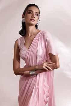 Pink pre-draped ruffle saree with embellished waistband. Comes with floral embellished blouse. - Aza Fashions Sleeveless Pre-draped Saree With Ruffles For Reception, Sleeveless Silk Pre-draped Saree For Wedding, Georgette Pre-draped Saree With Cape Sleeves, Pre-draped Georgette Saree With Cape Sleeves, Elegant Sleeveless Georgette Pre-draped Saree, Sleeveless Silk Pre-draped Saree For Reception, Elegant Sleeveless Pre-draped Saree For Reception, Elegant Sleeveless Pink Pre-draped Saree, Blouse Satin