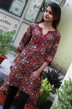 This is a beautiful 100% cotton Tunic Top Kurti, with beautiful block print look on self stitch embroidery fabric, and a high low style hem. Wear this tunic with leggings or pants for an elegant and modern look! works great as swim suit cover as well!! Item Features Pure Cotton Round Neck tunic with high low hem and 3/4 sleeves Average length of tunic : Front: 36 in / Back :43 in Length of product may slightly vary as per the sizes. Please note: smaller size may be slightly shorter and bigger si Traditional Navratri Tunic With Printed Motifs, Festive Printed Straight Kurta Tunic, Festive Straight Kurta Printed Tunic, Red Cotton Kurta With Floral Print, Red Cotton Floral Print Kurta, Festive Multicolor Block Print Tunic, Cotton Anarkali Tunic Kurta, Cotton Anarkali Style Kurta Tunic, Cotton Anarkali Style Tunic Kurta