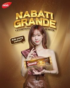 a woman holding a chocolate bar in front of her face and the words nabati grande written on it