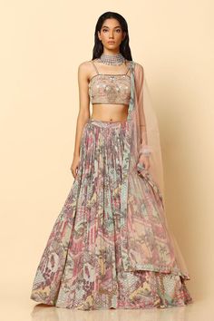 Blush pink plain net lehenga with an attached cancan, abstract print and glass beads and sequins embroidery. Comes with a padded blouse and a dupatta.
Components: 3
Pattern: Printed, Embroidered
Type Of Work: Abstract, Glass beads, Sequins
Neckline: Square Neck
Sleeve Type: Sleeveless
Fabric: Net
Color: Pink
Other Details: 
Attached lining
Length:
Blouse: 14.5 inches
Lehenga: 46 inches
Model Height: 5ft 9inches, wearing size M
Product Weight: 4.5 Kgs
Closure:
Blouse: Side zip
Lehenga: Side zip a Bohemian Embellished Georgette Lehenga, Pink Hand Embellished Organza Choli, Pink Bohemian Floor-length Lehenga, Bohemian Style Pink Floor-length Lehenga, Bohemian Pink Floor-length Lehenga, Bohemian Style Hand Embellished Wedding Sets, Bohemian Hand Embellished Wedding Set, Bohemian Wedding Sets Hand Embellished, Pink Hand Embellished Georgette Sets