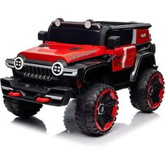 a red and black toy truck on a white background