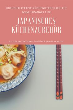 a bowl of soup with chopsticks next to it on a white table top