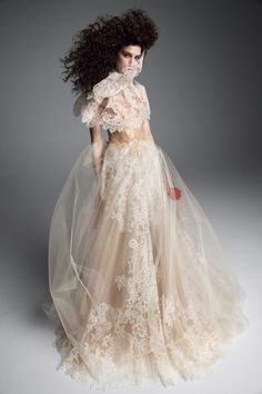 a woman in a wedding dress with long hair