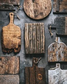 various wooden cutting boards and tools laid out on a table