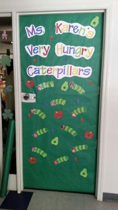 a classroom door decorated with the very hungry caterpillars