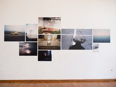 a white wall with many pictures on it and a wooden floor in front of it