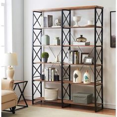 a living room filled with furniture and a book shelf