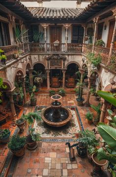 an indoor courtyard is shown with potted plants