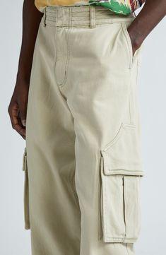 Rhuigi Villaseñor continues to elevate traditional streetwear with all-cotton cargo pants refreshed in the baggy fit seen all over the 2024 runways. Uniquely shaped pocket flaps further the statement-making aesthetic. Zip fly with hook-and-bar closure Front slant pockets; back patch pockets; cargo bellows pockets Lined 100% cotton Dry clean Made in the USA Designer Clothing Tapered Leg Cotton Cargo Jeans, Cotton Tapered Leg Cargo Pants With Multiple Pockets, Cotton Cargo Pants With Multiple Pockets And Tapered Leg, Straight Leg Cotton Cargo Pants With Pockets, Urban Straight Leg Cotton Cargo Pants, Cotton Cargo Pants With Tapered Leg And Cargo Pockets, Baggy Cotton Cargo Jeans With Pockets, Khaki Cotton Tapered Leg Cargo Jeans, Khaki Cotton Cargo Pants With Patch Pockets