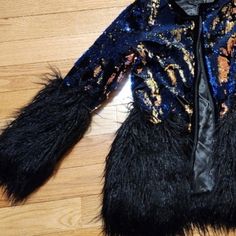 Fits True To Size. Zip Up Entry & Pockets. I Also Have A Silver/Gray Version Of This Coat Listed In A Size Medium. Faux Fur, Velvet Trimmed, And The Prettiest Sequins. They Are The Kind That Will Change Color When You Run Your Hand Over Them. The Fur Is Black, And The Sequins Are Blues, Copper- Ish & Black Color. This A Show Stopper For Sure! Glamorous Long Sleeve Outerwear For Costume Party, Black Blazer For Fall Costume Party, Fitted Glamorous Outerwear For Costume Party, Glamorous Fitted Outerwear For Costume Party, Glamorous Long Sleeve Outerwear For Fall, Glamorous Long Sleeve Fall Outerwear, Glamorous Fitted Outerwear For Fall, Long Vest Jacket, Faux Mink Coat