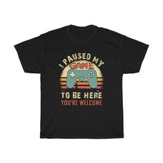 I Paused My Game To Be Here You're Welcome Shirt, Gamer Shirt, Funny Gaming T-shirt, Men's Women Kids, Gamer Gift, Gaming Present. Great present for the gamer in your life for any occasion and for any age.  Perfect gift for the video game enthusiast, gamer, retro gamer, console gamer, pc gamer, and everyone in between. This heavy cotton tee has the classic cotton look and feel. Casual elegance will make it an instant favorite in everyone's wardrobe. .: Classic fit .: 100% Cotton (fibre content may vary for different colors) .: Light fabric (5.3 oz/yd² (180 g/m .: Tear away label .: Runs true to size Rude T Shirts, Horror Movie Shirts, Funny Gaming, Gamer Shirt, Retro Gamer, Movie Shirts, Gamer Gifts, Limassol, Pc Gamer