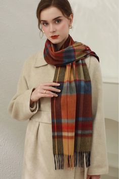 Cashmere Elegance in Classic Plaid Add a touch of luxury and style to your winter ensemble with our Christmas Plaid Cashmere Fringe Scarf. Made from plush cashmere, this scarf offers exceptional warmth without the bulk. The classic Scottish plaid design makes it a versatile piece for any outfit. Measuring 180cm x 30cm, it can be worn as a scarf or shawl for added convenience. Style #: WKAI510 Classic Red Scarves For Winter, Red Wool Winter Scarves, Red Wool Scarves For Winter, Elegant Brown Scarves For Winter, Elegant Brown Winter Scarves, Elegant Red Scarf For Fall, Winter Formal Multicolor Outerwear, Elegant Multicolor Scarves For Fall, Formal Multicolor Winter Outerwear