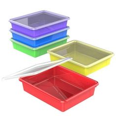 three different colored plastic containers with lids and spoons in the bottom one is empty