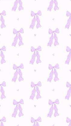 pink bows and hearts on a white wallpaper with pastel purple colors in the background