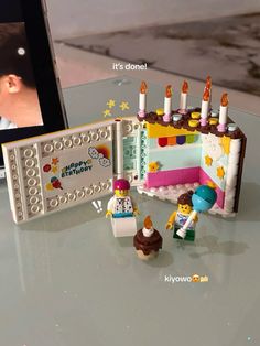 a lego birthday cake with candles on it