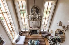 an aerial view of a living room with large windows