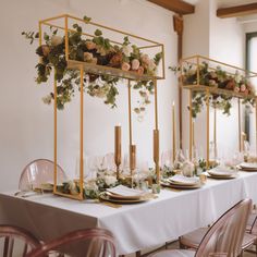 the table is set with flowers and candles for an elegant dinner party or wedding reception