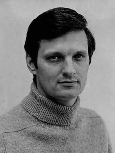 black and white photograph of a man wearing a turtle neck sweater