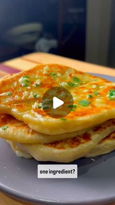 a stack of pancakes sitting on top of a white plate